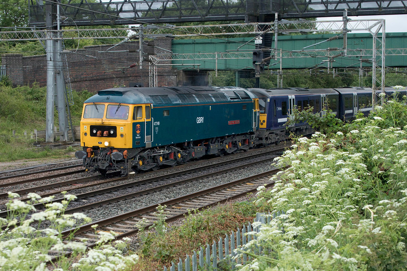 47749 & 360105, 11.10 Ilford EMUD-Northampton EMD (7Q60, 2L), Gordon`s Lodge 
 As I was watching this train approach and pass under the bridge at Gordon's Lodge through the viewfinder it was moving very slowly and looked just like so many trains that I had photographed back in the 1970s and 1980s! Indeed, as a West Country lad, I will have seen this particular locomotive so many times in an earlier guise as 47076 being one of the fifteen named Western Region members of the class. Now as 47749 'City of Truro' it is seen leading the 7Q60 that is hauling a former Greater Anglia Desiro 360105 from its former base at Ilford to Northampton. I am unsure as to why exactly this move was taking place but it is to do with its future use on the MML between Corby and London St. Pancras. 
 Keywords: 47749 360105 11.10 Ilford EMUD-Northampton EMD 7Q60 Gordon`s Lodge City of Truro Desiro GA Greater Anglia