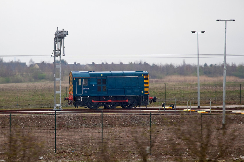 08454, stabled, Alstom Technology Centre, Ditton 
 Taken from our train as it leaves Merseyside, 08454 looking very smart, is viewed at the Alston Technology Centre at Ditton. 08454 was built at Derby in 1958 and initially allocated to 17B (Burton-on-Trent) and then moved back to its birth place, 16C (Derby) where it was withdrawn in 1981. After storage, it was reinstated in 1985 ending up at Longsight. Now, it has a new lease of life being used by Alstom at their Technology Centre for moving various stock (very carefully no doubt!) around the plant. 
 Keywords: 08454 Alstom Technology Centre, Ditton