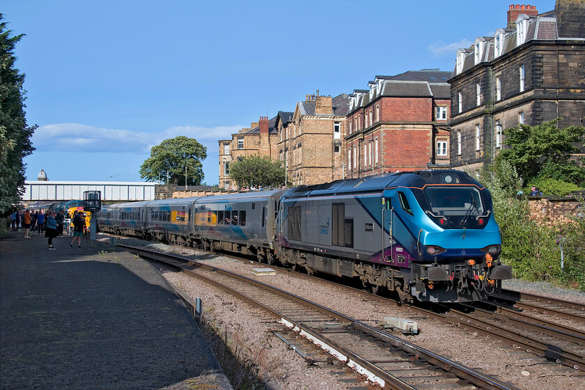 68020, TP 16.04 York-Scarborough (1U59, 2E), Scarborough station 
 At the far end of Scarborough station, the 16.04 York to Scarborough TPE service is seen arriving with 68020 'Reliance' propelling at the rear. Behind the gathering of enthusiasts to the left 55009 'Alycidon' is seen now fired up and ready to lead the returning Coronation deltic charter to King's Cross. Unfortunately, things did not go quite to plan with the charter being terminated at Finsbury Park after a complete failure of the Detic at Retford.

NB this turned out to be my last photograph of one of TPE's excellent Nova3 sets with the whole fleet being taken out of service and off-lease a couple of months later. Put into 'warm storage' some of the best and newest stock on the network now lies idle; what a shambles. (added 03.24) 
 Keywords: 68020 16.04 York-Scarborough 1U59 Scarborough station Trans Pennine Express TPE Nova 3