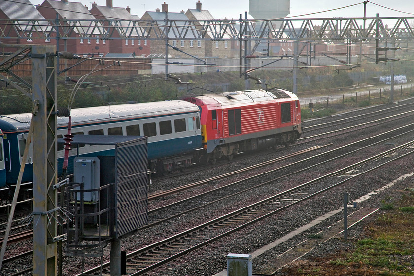 67004, outward leg of The Severn Valley Autumn Special, 08.07 London Euston-Kidderminster SVR (1Z67), site of Roade station 
 67004 always looks smart in its DB livery so is always worth a photograph. Here it is being dragged along for the ride at the rear of The Severn Valley Autumn Special running as 1Z67. The special, that left Euston for Kidderminster at 08.07, is seen passing the site of Roade station. 
 Keywords: 67004 The Severn Valley Autumn Special 08.07 London Euston-Kidderminster SVR 1Z67 site of Roade station special excursion Severn Valley Railway