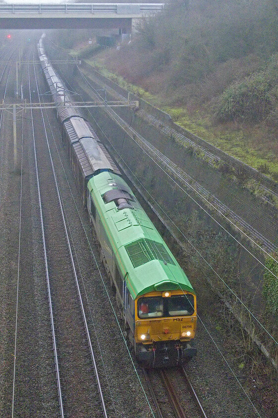 66796, 14.05 DIRFT-Dollands Moor (6O51, RT), Roade cutting 
 At last - a photograph of the unique liveried 66796 'The Green Progressor! It arrived in the UK in 2021 from Germany and was immediately chosen for the one-off look it has worn since being named in September of that year by fifteen years old rail enthusiast Jermaine Allen from Leeds. It is seen leading the 6O51 14.05 Daventry to Dollands Moor empty 'water train' through Roade. 
 Keywords: 66796 14.05 DIRFT-Dollands Moor 6O51 Roade cutting GBRf