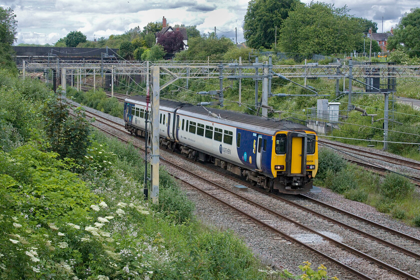 150454, 09.36 Heaton TMD-Wolverton Centre Sidings (5H70, 44E), site of Roade station 
 The sight of a Northern Class 150 on the up fast line of the WCML is not something seen every day! 150454 is seen passing Roade on the up fast due to the planned closure of the slow lines through Northampton having almost completed its journey as the 5H70 09.36 Heaton TMD (Newcastle) to Wolverton Centre Sidings. There have been a number of these moves bringing the Northern units south for repair work largely relating to corrosion damage rather than a complete overhaul. They seem to spend about a month at Wolverton before returning. 
 Keywords: 150454 09.36 Heaton TMD-Wolverton Centre Sidings 5H70 site of Roade station Northern