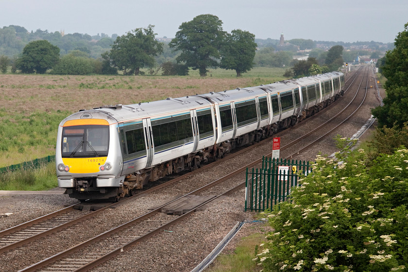 168267 & 168214, CH 07.00 London Marylebone-Birmingham Snow Hill (1G09), Warkworth SP476394 
 After a dull start to the day, the sun is just starting to burn through the mistiness just south of Banbury. 168267 and 168214 head north near Warkworth as the 07.00 Marylebone to Birmingham Snow Hill working. The elevated position here is provided by the embankment of the M40 motorway. 
 Keywords: 168267 168214 07.00 London Marylebone-Birmingham Snow Hill 1G09 Warkworth SP476394