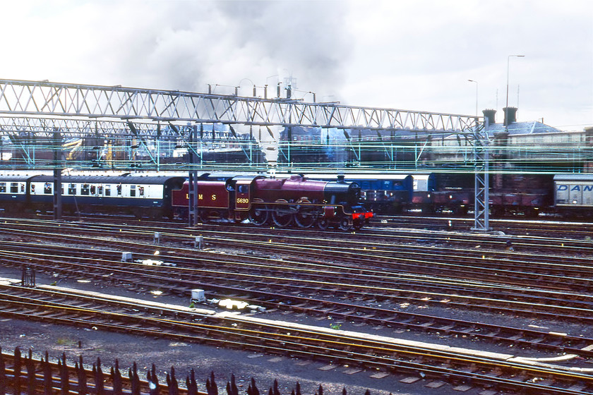 5690, BR sponsored Manchester-Liverpool Edge Hill Special, Edge Hill 
 I must have become a little overwhelmed by the sight of LMS Jubilee 5690 at Edge Hill as this one of three rather similar photographs that I took! With each Kodachrome slide costing me a fair few pence, this was a bit of a surprise! After being held for a short while in the yard the train moves away towards the station a short distance to my right under the bridge where the locomotive would be detached ready to run round on the Wavertree triangle.

There is an audio recording of this event on my youtube channel, see..https://youtu.be/dC3Vdy6E4t8 
 Keywords: 5690 BR sponsored Manchester-Liverpool Edge Hill Special Edge Hill LMS Jubilee 45690