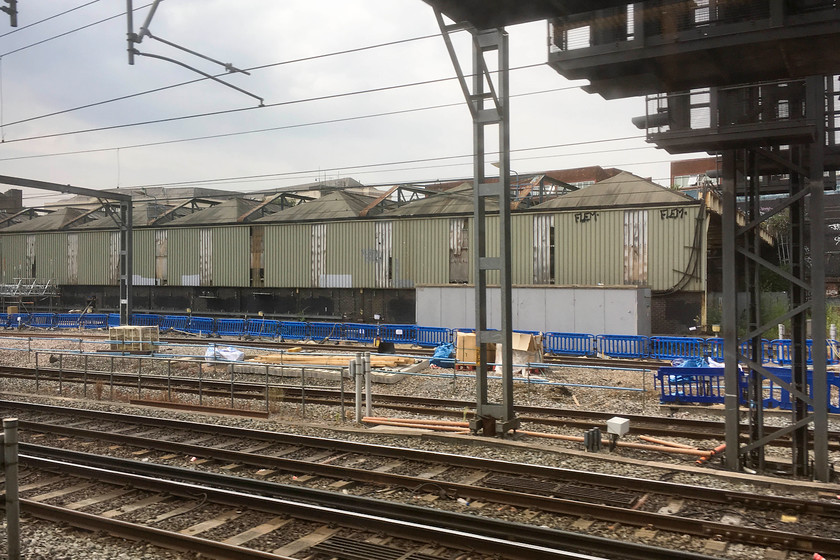 Demolition of Euston Downside Carriage Maintenance Depot 
 The Euston Downside shed and sidings have not been used since locomotive hauled trains finished in 2004/5. Since then, it had its catenary removed, become increasingly overgrown and has structurally deteriorated. Finally, a concerted move has been made to demolish it and this process is under way as seen in this image.