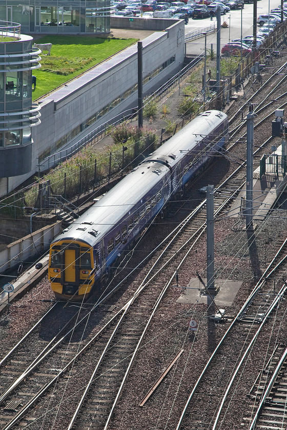 158702, SR 15.31 Tweedbank-Edinburgh Waverley (2T91), top of Jacob`s Ladder 
 Taken from the top of Jacob's ladder steps, 158702 rolls into Edinburgh Waverley with the 15.31 from Tweedbank. I would really fancy having a job in the office overlooking the station throat on the left of this image but I should that I would be trifle distracted during a boring meeting by all the comings and goings outside! This building, called Waverley Court, is the home of the City of Edinburgh's Council. 
 Keywords: 158702 15.31 Tweedbank-Edinburgh Waverley 2T91 top of Jacob`s Ladder