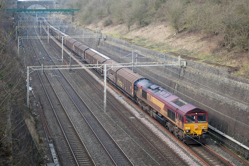 66139, 14.05 Daventry-Dollands Moor (6O67), Roade Cutting 
 The daily 14.05 Daventry International Railfreight Terminal (DIRFT) to Dollands Moor empty cargo wagons working is seen heading through Roade Cutting with 66139 leading. This is a relatively easy load for the recently acquired DB loco. as this working is empty for the whole journey. As it's empty, the wagons make a lot more noise with no contents to dampen their sound. 
 Keywords: 66139 14.05 Daventry-Dollands Moor 6O67 Roade Cutting