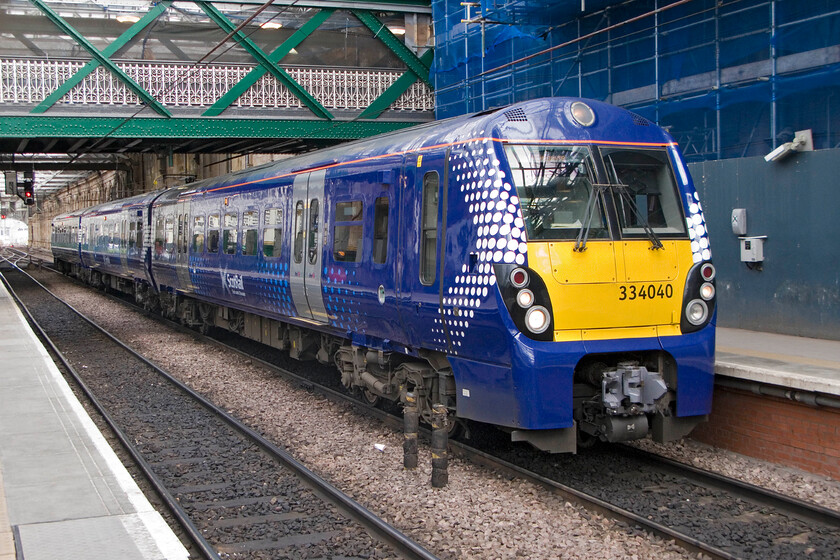 334040, SR 16.37 Edinburgh Waverley-Milngave, Edinburgh Waverley station 
 The Class 334 Coradia Junipers have been in service on Scottish electrified lines for some ten years now with the first ones being fully refurbished (more of a complete rebuild in fact!) from funding awarded by Transport Scotland. One of the refurbished units wearing its smart ScotRail livery waits to leave Edinburgh Waverley with the 16.37 service to Milngave. 
 Keywords: 334040 16.37 Edinburgh Waverley-Milngave Edinburgh Waverley station