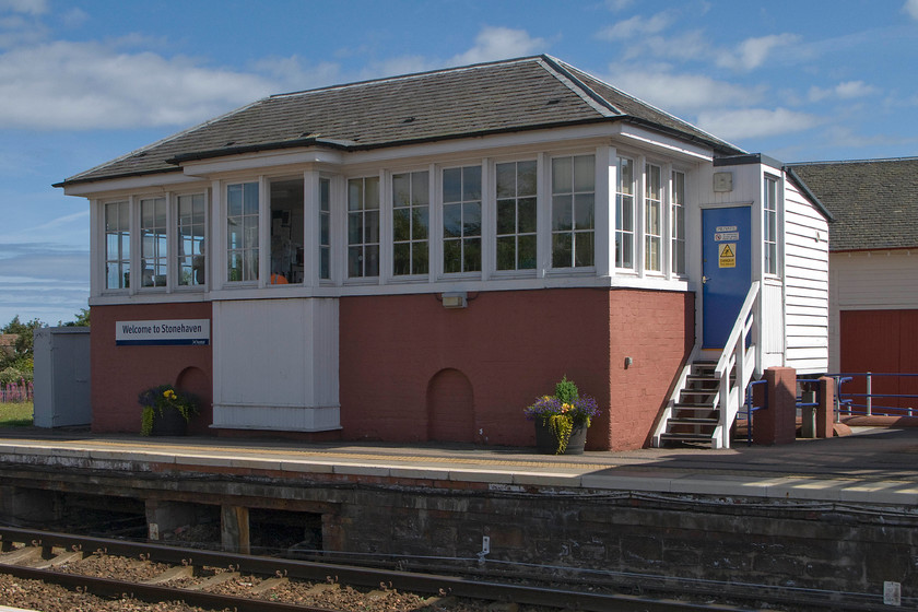 Stonehaven signal box (Caledonian, 1901) 
 Stonehaven signal box is a delightful structure that presents in excellent condition and looks to be relatively unmolested, even the windows look original. It is a Caledonian Railway (Northern Division) Type 2 box installed in 1901 in a prominent position on the up platform next to the station building. According to Historic Environment Scotland, it is of historical importance along with the station as a whole having a "piend-roofed, rectangular-plan signal box comprising painted brick base with two blocked round-arched openings flanking shallow projection at centre, and small-pane glazing to timber frame windows to NW, NE and SW. Small boarded timber outshot to left at SE. Timber forestair to signal cabin. Grey slate". When the mechanical signalling is replaced in the coming few years I think that it would make a great station caf rather like Totnes, see..... https://www.ontheupfast.com/p/21936chg/24745324204/signal-box-cafe-totnes-totnes-station 
 Keywords: Stonehaven signal box Caledonian