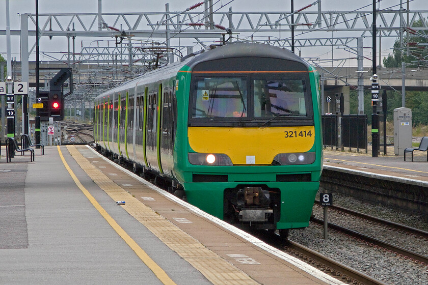 321414, 11.24 London Euston-Milton Keynes Central ECS (5K43), Milton Keynes Central station 
 In order to ease congestion problems caused by the closure of lines close to Euston emergency ECS workings were put into place. Not normally seen during the day out of peak times, 321414 arrives at Milton Keynes to operate a relief service south to get passengers as far towards London as possible. 
 Keywords: 321414 11.24 London Euston-Milton Keynes Central ECS 5K43 Milton Keynes Central station London Midland Dusty Bin