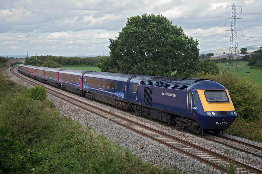 43164 & 43188, GW 15.57 London Paddington-Plymouth (1C87, 12L), Berkley ST802494 
 43164 leads with 43188 at the rear past Berkley between Westbury and Frome. It is forming the 1C87 15.57 Paddington to Plymouth. Notice the Westbury White Horse is catching some afternoon sunshine just to the left of the electricity pylon in the background. 
 Keywords: 43164 43188 1C87 Berkley ST802494