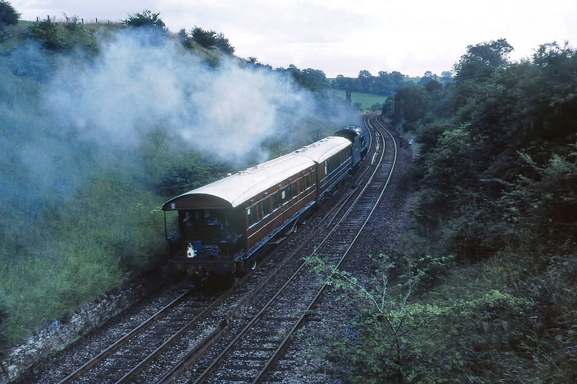 850 & Gresley support coaches, Skipton-Manchester Liverpool Road (for Great Railway Exposition), Nappa SD858536 
 A 'going away' shot of 850 'Lord nelson' leading two Gresley LNER teak coaches as it descends from Hellifield at Nappa. On the rear of the coach, the headboard from the morning's Cumbrian Mountain Express is seen attached next to the tail light. The coaches were being taken to Manchester Liverpool Road in association with The Great Railway Exposition that was part of the Rocket 150 celebrations in and around Liverpool and Manchester. I am not sure about the heritage of the rear coach here with its observation platform, can anybody advise? 
 Keywords: 850 Lord Nelson Gresley support coaches, Skipton-Manchester Liverpool Road Great Railway Exposition Nappa SD858536