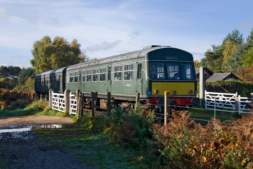 M56352 & M51192, 10.30 Holt-Sheringham, Kelling Heath 
 On a bright but chilly Autumnal morning, M56352 and M51192 rattle across Kelling Heath working the 10.30 Holt to Sheringham service. Whilst there was a myriad of DMU classes during British Railways and into BR days the Class 101s were amongst the most reliable with many making it into the preservation world on heritage lines. The North Norfolk Railway alone has three sets of Class 101s in various conditions and states of operation. 
 Keywords: M56352 M51192 10.30 Holt-Sheringham Kelling Heath Class 101 DMU