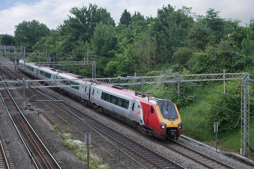 Class 221, VT 13.10 London Euston-Chester (1D87, 2L), Victoria Bridge 
 An unidentified class 221 head north forming the 13.10 Euston to Chester. It is seen passing Victoria Bridge just south of Roade in Northamptonshire on a dull June day. 
 Keywords: Class 221 1D87 Victoria Bridge