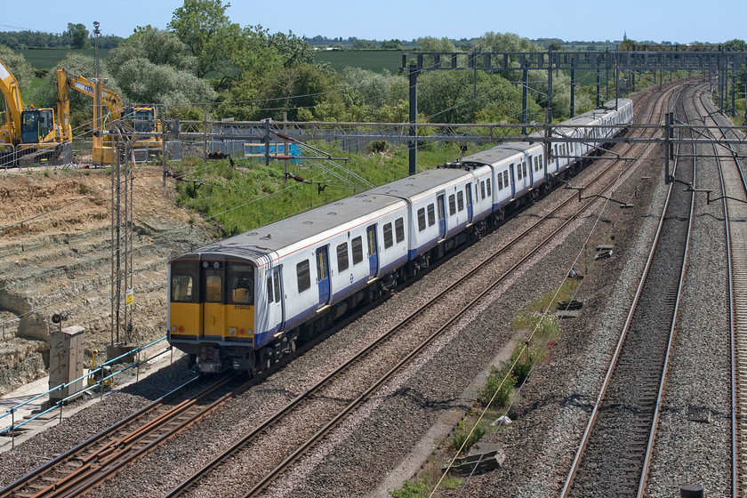 315533 & 315578, 11.53 Northampton EMD-Northampton EMD (5Q21, 1L), Ashton Road bridge 
 For a number of months, a collection of ex London Overground's Class 315 EMUs have been, as what is colloquially referred to, in 'warm storage'. As part of this storage, the units are periodically run to maintain their operational condition. Just south of Roade at Ashton Road bridge 315533 and 315578 head south towards Bletchley where they will return again as the 5Q21 11.53 Northampton EMUD return working. I am not absolutely sure as to why these units are being stored. If anybody can update with the thinking behind it, please contact me via https://www.ontheupfast.com/contact 
 Keywords: 315533 315578 11.53 Northampton EMD-Northampton EMD 5Q21 Ashton Road bridge London Overground