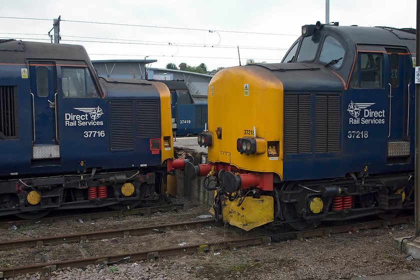 37716, 37419 & 37218, stabled, Norwich station 
 A gathering of veteran English Electric engines stabled at Norwich. 37716, 37419 'Carl Haviland 1954 - 2012' and 37216 are all seeing no use working the fabled trains to the coast for Greater Anglia as all the lines were closed due to engineering works. These works were in preparation for next year's complete re-signalling. 
 Keywords: 37716 37419 37218 stabled, Norwich station