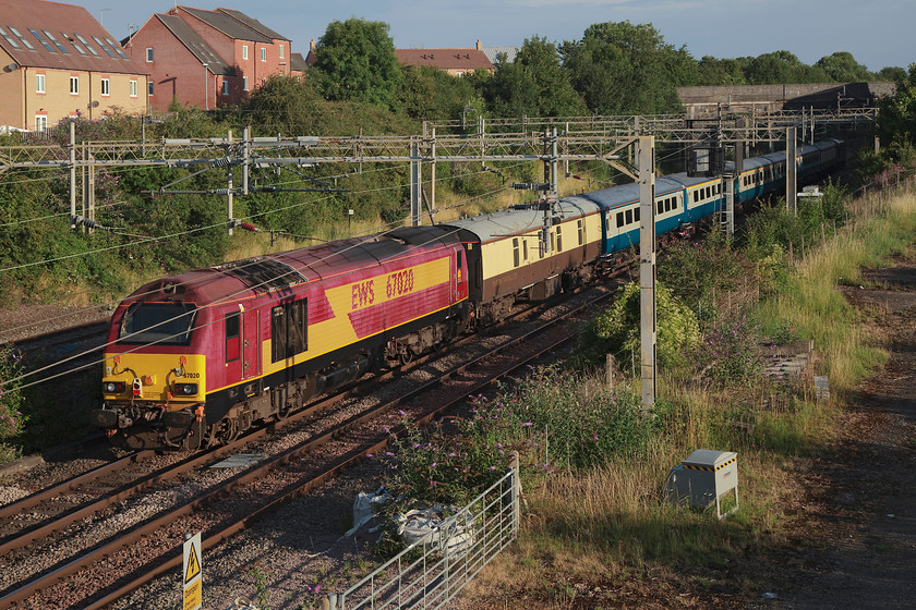 67020, 06.00 London Euston-Southport golf Open-special (1Z42), site of Roade station 
 With its paintwork looking a little faded, 67020 brings up the rear of the 06.00 Euston to Southport Open golf special. It is seen passing the site of Roade station in Northamptonshire near to the start of its journey to the north west. 
 Keywords: 67020 06.00 London Euston-Southport golf Open-special 1Z42 site of Roade station