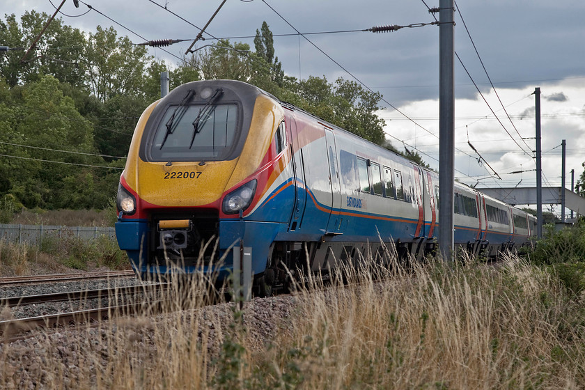 222007, EM 13.47 London St. Pancras-Corby (1M41, 6L), Sundon Loops TL034279 
 222007 heads north past Sundon Loop with the 13.47 London St. Pancras to Corby. I am standing by the old lineside fence to take this picture as this section of line has yet to suffer from the installation of palisade fencing. 
 Keywords: 222007 1M41 Sundon Loops TL034279