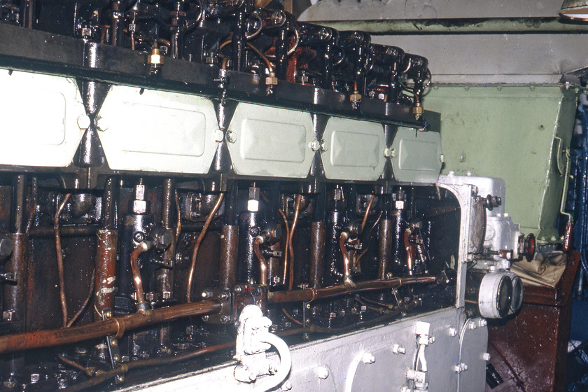 MV Farringford, engine 
 On the return ferry crossing, Graham and I were permitted 'access all areas' by the very accommodating crew. This included a trip into the engine room of MV Farringford and quite a noisy place it was too. One of the English Electric Crossley six-cylinder engines is seen. They were unusual in that as in the majority of vessels they were not direct-acting but actually drive electrical motors that then acted on the paddles. This is the same way that the vast majority of diesel locomotes operate. One of the generators can seen at the very bottom right-hand corner of the image. Notice the exposed pushrods acting on the valves at the top of the engine block 
 Keywords: MV Farringford engine