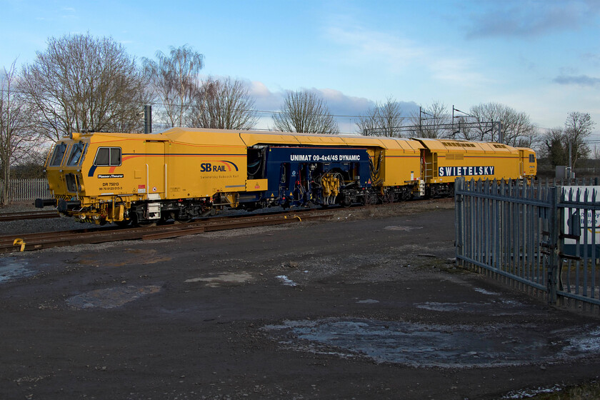 DR75013, stabled, site of Blisworth station 
 Owned and operated by Swietelsky Babcock Rail (SBRail) DR75013 stands stabled at Blisworth in the CE sidings on the site of the old station. Despite being stabled and awaiting its next duty, it was showing live on OpenTrainTimes so perhaps it would be in use sooner than later. I suspect that it will head north along the down main line to Hillmorton Junction once the repairs to the embankment have been completed that have required the closure of the line for nearly a month. 
 Keywords: DR75013 site of Blisworth station Swietelsky Babcock Rail SBRail