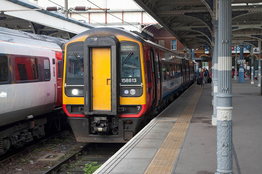 158813, EM 11.57 Norwich-Liverpool Lime Street (1R86), Norwich station 
 158813 preparing to leave Norwich's platform three with the 11.57 to Liverpool Lime Street. This 237 mile journey winds its way from east to west across the country but I am now wholly convinced that completing it in a two-car car class 158 is the way to go! 
 Keywords: 158813 11.57 Norwich-Liverpool Lime Street 1R86 Norwich station