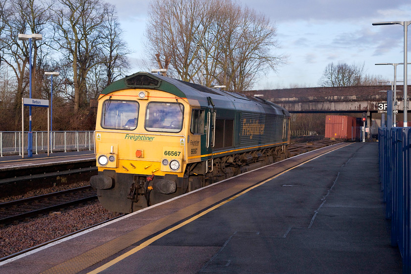 66567, 07.21 Lawley Street-Southampton (4O15), Banbury station 
 66567 speeds through Banbury station with the 07.21 Lawley Street to Southampton Freightliner working. Even though photography in winter can be challenging, I love the quality of light when the sun is out. The low angle of the sun means that there are often less darker areas of shadow on the subject that you get in the summer months when the sun is more overhead. 
 Keywords: 66567 0721 Lawley Street to Southampton 4O15 Banbury