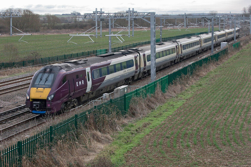 222004, EM 13.35 London St. Pancras-Nottingham (1D43, RT), Harrowden Junction 
 222004 accelerates north away from Wellingborough passing Harrowden Junction working the 1D43 13.35 St. Pancras to Nottingham service. Notice the lower lip under the Delinier coupling gear that has obviously been replaced with a stock item from when they were painted in their East Midlands Trains livery. I suppose any unnecessary expense such as repainting is not being undertaken given that the Meridians are only going to be active on the MML for another year or so. 
 Keywords: 222004 13.35 London St. Pancras-Nottingham 1D43 Harrowden Junction EMR East Midlands Railway Meridian