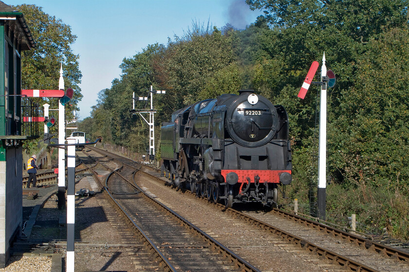 92203, running round, Holt station 
 Amongst a fine array of semaphore signalling at Holt that includes no less than three reproduction somersault signals 92203 'Black Prince' runs around in order to then rejoin its stock to work back to Sheringham station. 
 Keywords: 92203 running round Holt station Black Prince