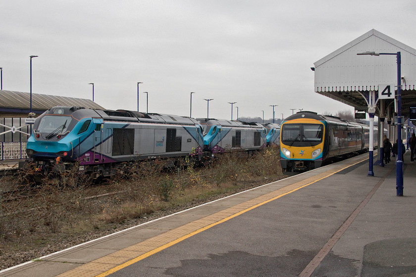 68021, 68027 & 68023, 09.22 York Siemens-Longsight (0M68) & class 185, TP 11.19 Manchester Airport-Newcastle (1P23, RT), Stalybridge station 
 A busy scene at Stalybridge station as a class 185 passes through working the 11.19 Manchester Airport to Newcastle service. How ironic that the class 185 DMU is passing three of the locomotives that will be replacing it soon on these services as TPE revert to using loco. hauled stock to address a number of issues on this, and other, routes. 68021 'Tireless', 68027 and 68023 'Achilles' pause on the middle platform forming the 09.22 York (Siemens) to Longsight training run. 
 Keywords: 68021 68027 68023 09.22 York Siemens-Longsight 0M68 class 185 TP 11.19 Manchester Airport-Newcastle 1P23 Stalybridge station