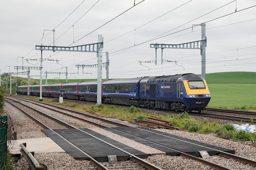 43012, 11.00 Bristol Temple Meads-London Paddington (1A14, 1L), Cholsey station 
 Taken from the station car park at Cholsey station 43012 'Exeter Panel Signal Box 21st Anniversary 2009' powers the rear of the 1A14 11.00 Bristol to London Paddington. 43012 has always been a Wester Region power car being one of the first into traffic in 1976 as part of set 253006. 
 Keywords: 43012 1A14 Cholsey station