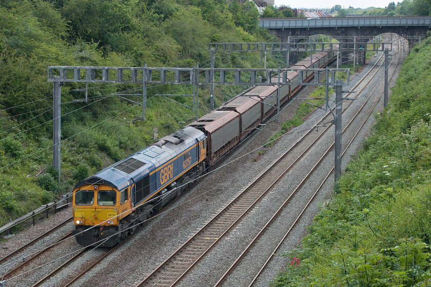 66757, 09.28 Dagenham Dock Reception-Garston Car Terminal (6X43, 21E), Hyde Road bridge 
 The daily Dagenham Dock Reception sidings to Garston Car Terminal cartic makes its way through Roade with GBRf's 66757 'West Somerset Railway' leading. The balancing working heads south empty in the early evening, see....https://www.ontheupfast.com/p/21936chg/30042343259/x66763-14-08-garston-dagenham-dock This train makes a change from the usual diet of 'liners that pass through Roade every day! 
 Keywords: 66757 09.28 Dagenham Dock Reception-Garston Car Terminal 6X43 Hyde Road bridge GBRf West Somerset Railway