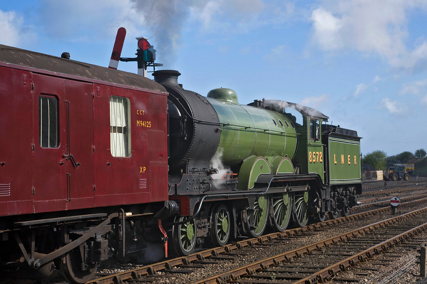 8572, 10.30 Holt-Sheringham, Weybourne station 
 I don't usually take going away photographs especially of a train the that I already have one shot of! However, the lighting and subject were perfect here at Weybourne on the North Norfolk Railway that I have submitted this one. It shows LNER B12 8572 getting away from the station with the 10.30 Holt to Sheringham NNR service. I like the inclusion of the somersault signal in this view, it's just a shame that it is partially blocked by the leading GUV M94125. 
 Keywords: 8572 10.30 Holt-Sheringham Weybourne station Poppy Line NNR North Norfolk Railway B12 4-6-0