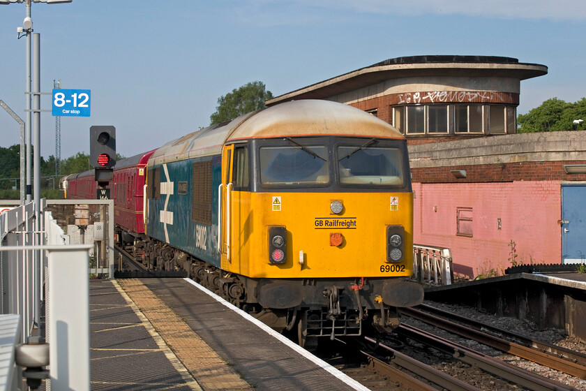 69002, 4TC set, 73109 & D6515, The Return of the Jurassic Crompton, 14.20 Swanage-London Waterloo (1Z35, 7L), Wimbledon station 
 Passing Wimbedon's former A signal box the rear of the returning Jurrasic Crompton charter is seen with 69002 'Bob Tiller CM&EE'. Just in front of the rebuilt Class 56 is the stock in the form of preserved 4TC set 413 with D6515 'Lt Jenny Lewis RN' and 73109 'Battle of Britain 50th Anniversary' leading. The train was running some twenty minutes late at one stage in its journey from Dorset but was rapidly making up time arriving just seven minutes adrift at Waterloo. 
 Keywords: 69002 4TC set 73109 D6515 The Return of the Jurassic Crompton 14.20 Swanage-London Waterloo 1Z35 Wimbledon station Lt Jenny Lewis RN Battle of Britain 50th Anniversary Bob Tiller CM&EE.