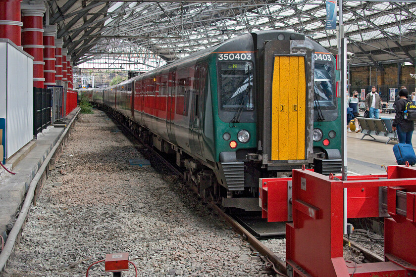 350403, LN 14.35 Birmingham New Street-Liverpool Lime Street (1F51, 5L), Liverpool Lime Street station 
 Of our three-part journey from Northampton to Liverpool, we managed to travel in two Class 350/4 sets. These ten sets are infinitely better than the other Class 350 subsets (350/1/2 and 3) with more comfortable and better-placed seats and being in much better internal condition. 350403 leads another unit after its arrival at Liverpool Lime Street having worked the 1F51 14.35 from Birmingham New Street. This platform used to be the preserve of Virgin and Avanti services but since the remodelling of Lime Street, these services have moved to the right of this image to platform nine. 
 Keywords: 350403 14.35 Birmingham New Street-Liverpool Lime Street 1F51 Liverpool Lime Street station London Northwestern Desiro