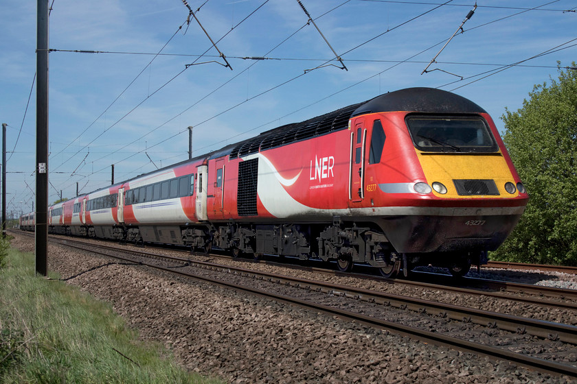 43277 & 43320, GR 07.52 Aberdeen-London King`s Cross (1E11, RT), Hough Lane SK860485 
 43277 leads with 43320 at the rear working the 07.52 Aberdeen to King's Cross. The train has one hundred and fifteen miles to go in order to complete its journey from Scotland, something it has been doing for many years but one that is due to end soon as the bi-mode Azumas begin to operate these services. The HST is seen passing Hough Lane level foot crossing just south of the village of Claypole. 
 Keywords: 43277 43320 07.52 Aberdeen-London King`s Cross 1E11 Hough Lane SK860485