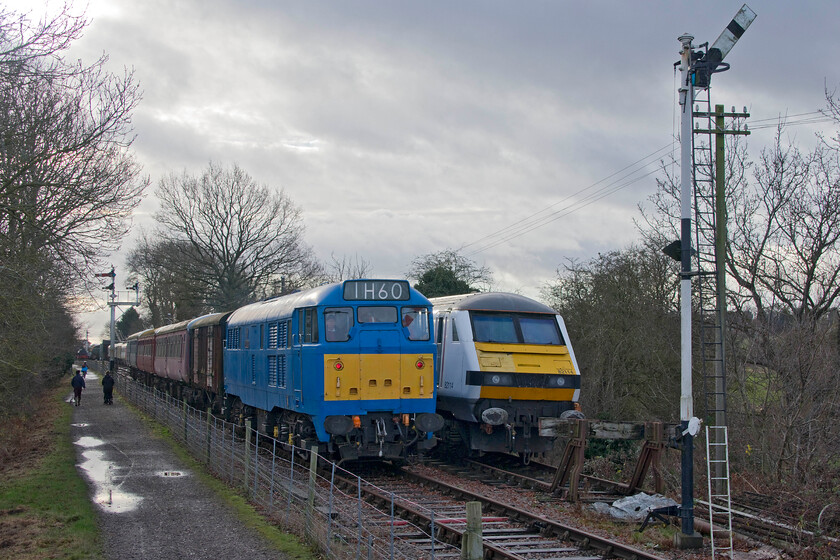 31289 & 82114, 11.00 Pitsford return, Bridge 14 
 My first railway photograph of 2022 shows 31289 'Phoenix' leading the 11.00 return service from Pitsford and Brampton station. It is passing former Greater Anglia DVT 82114 that has been a resident on the line, along with four former GA Mk.IIIs, since the spring of 2020 but none, apart from TSOB Coach 10412 that is now a fixed buffet facility, have seen any use. The photograph is taken from the NLR's bridge 14 just to the north of Pitsford and Brampton station. 
 Keywords: 31289 82114 11.00 Pitsford return Bridge 14 NLR Northampton & Lamport Railway Phoenix Greater Anglia DVT