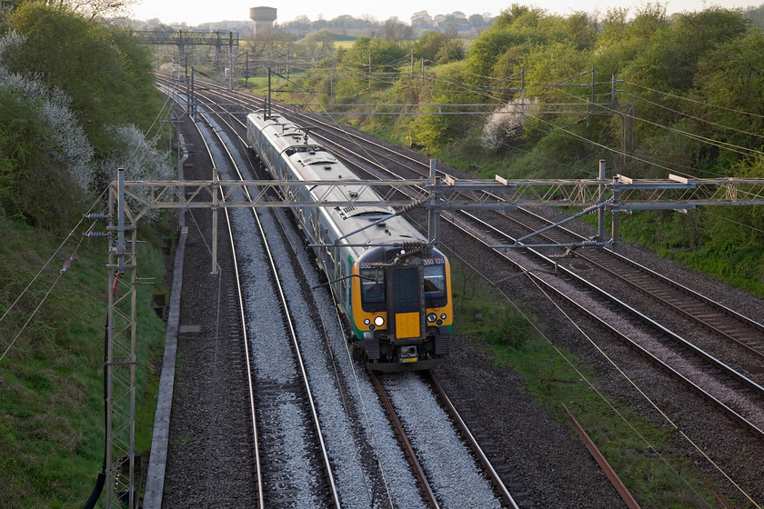 350125, LN 17.02 Crewe-London Euston (2U40, RT), Victoria Bridge 
 With the soft evening light of spring enhancing the background, 350125 runs on the up fast past Victoria Bridge just south of Roade forming the 17.02 Crewe to London Euston. One of Roade's notable water towers can be seen on the skyline. 
 Keywords: 350125 2U40 Victoria Bridge