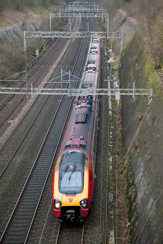 Class 221, VT 14.10 London Euston-Chester (1D88, 2E), Roade Cutting 
 An unidentified class 221 powers through Roade Cutting forming the 14.10 London Euston to Chester (1D88). I observe and travel on these five-car units quite regularly and find them totally inadequate both in terms of passenger capacity and general ambiance. 
 Keywords: Class 221 1D88 Roade Cutting