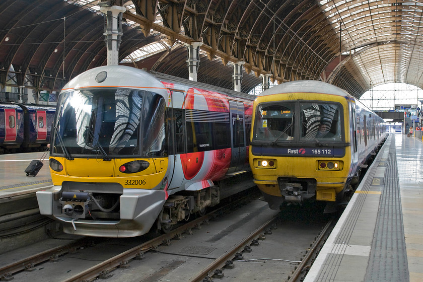 332006, HX 14.10 London Paddington-Heathrow (1T60) & 165112, GW 13.01 Oxford-London Paddington (1P45), London Paddington station 
 In the style stakes, the Heathrow Express Class 332s are winners! With their huge curved screens and stylish light clusters they certainly look the part so it's s shame that they only operate between Paddington and Heathrow. 332006 waits at Paddington to work the 14.10 service to Heathrow Terminal four. The Turbo unit next to it in the form of 165112 is from another era of design and looks decidedly aged by comparison. 165122 has just arrived with the 1P45 13.01 from Oxford. 
 Keywords: 332006 14.10 London Paddington-Heathrow 1T60 165112 13.01 Oxford-London Paddington 1P45 London Paddington station First Great Western Turbo Heathrow Express