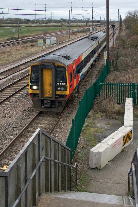 158858, EM 10.40 Nottingham-Norwich (1L07, RT), Marholm TF154036 
 158858 approaches Peterborough from the north and is about to pass the new Werrington dive-under junction that is all but completed. The EMR service is the second of the clockface Nottingham to Norwich trains that we observed with this one leaving Nottingham at 10.40 taking just less than an hour to reach this location on its journey to Norwich. 
 Keywords: 158858 10.40 Nottingham-Norwich 1L07 Marholm TF154036 East Midlands Railways