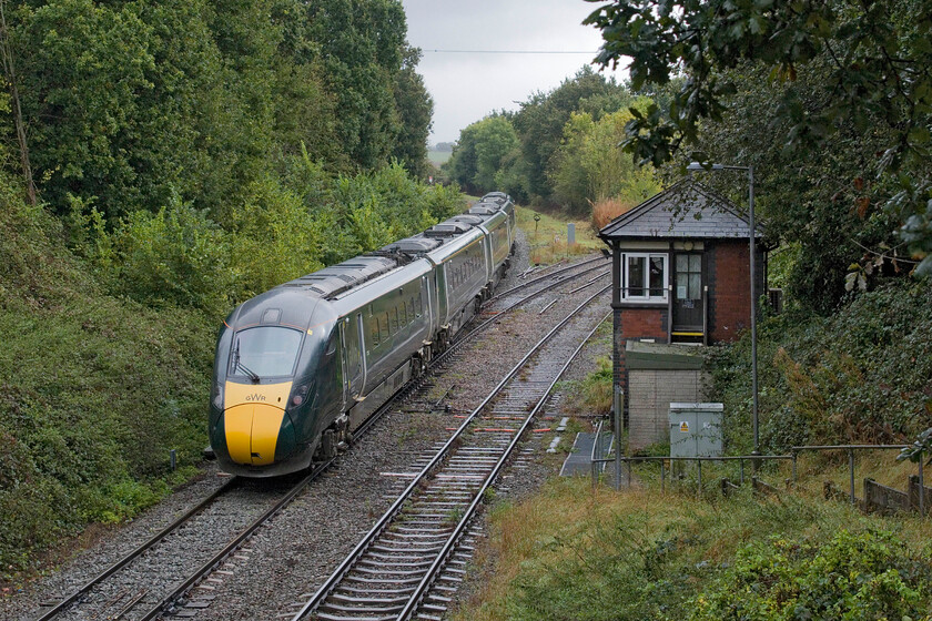 800005, GW 10.59 Great Malvern-London Paddington (1P26, 6L), Norton Junction 
 Having seen 800005 'Aneurin Bevan NHS 1948-2023' earlier in the morning at Moreton-in-Marsh, here it is again returning to the capital working the 10.59 Great Malvern to Paddington service. This is a 'going away' shot as the train passes Norton Junction signal box as it slows for its stop at Worcestershire Parkway station which is located just around the curve to the left. 
 Keywords: 800005 10.59 Great Malvern-London Paddington 1P26 Norton Junction Aneurin Bevan NHS 1948-2023