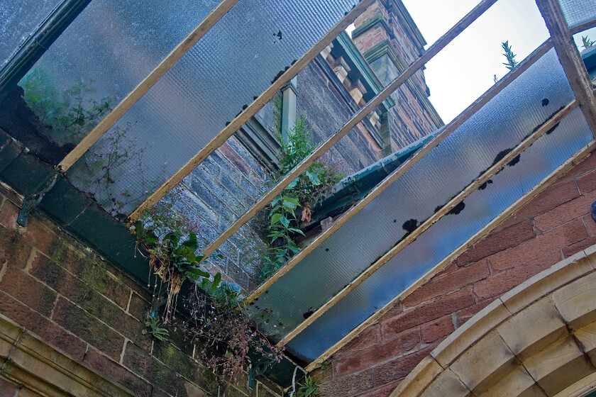 Canopy, Ulverston station 
 The condition of Ulverston station is a disgrace and, as a Grade II listed property and I am surprised that more pressure has not been brought to bear on Northern and Network rail to put things right. I did find an archived article in the online Westmoreland Gazette stating that work was to start. However, apart from a little scaffolding supporting the roof structure at the eastern end of the down platform, I could see no evidence of this work. I hope that it starts soon as in places the superb station building is in a parlous state. 
 Keywords: Canopy Ulverston station