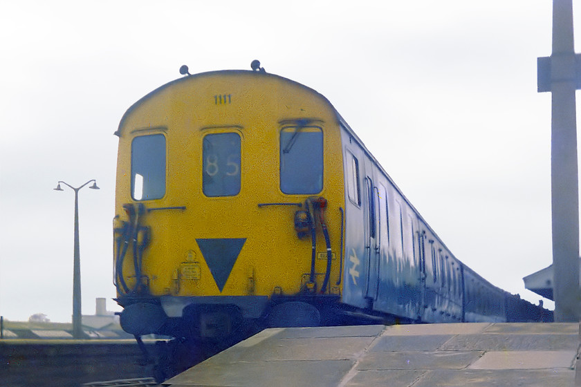 1111, unidentified up working, Westbury station 
 Class 205 DEMU number 1111 leaves Westbury station with a service for Bristol Temple Meads. I liked these units, they were a little different to the usual fare in the West Country and they made great noise! I also liked these versions as they had full width compartments with no corridors. 
 Keywords: 1111 Westbury station