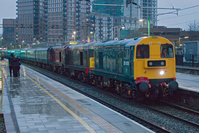 20205, 20007 & 20142, 13.54 Kidderminster SVR-Watford Junction positioning move (1Z57, 6E), Watford Junction station 
 It's not very often that one sees a triple-headed English Electric train on the mainline, let alone on the busy West Coast Mainline just north of London! At a wet and dismal Watford Junction, the 13.54 ex Kidderminster SVR positioning move comes to a halt for the passengers to alight and make their own way onwards with the train now running empty stock to Wembley Yard as 5Z27. The trio of locomotives is led by 20205, 20007 and 20142 'Sir John Betjamin' with HST power cars 43430 and 43468 out of sight on the rear. Within a few minutes the platform was absolutely packed with enthusiasts who had alighted from the train; I don't know what Watford Junction knew quite what had hit it! 
 Keywords: 20205 20007 20142 13.54 Kidderminster SVR-Watford Junction positioning move 1Z57 Watford Junction station Sir John Betjamin