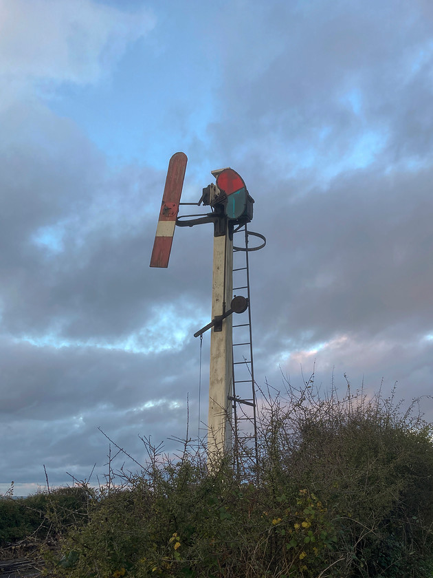 GN somersault starter signal, Weybourne 
 The North Norfolk Railway has worked hard to create a proper themed working museum keeping things as genuine as possible. The results are that it has a superb 'period-feel' with things such as GN (Great Northern) signalling around Weybourne. This somersault signal is the up starter at Weybourne and would have been found throughout Norfolk in pre-grouping years and for a long time afterwards. It just catches the last vestiges of afternoon light against a 'big' Norfolk sky stretching out over the North Sea. 
 Keywords: GN somersault starter signal, Weybourne.