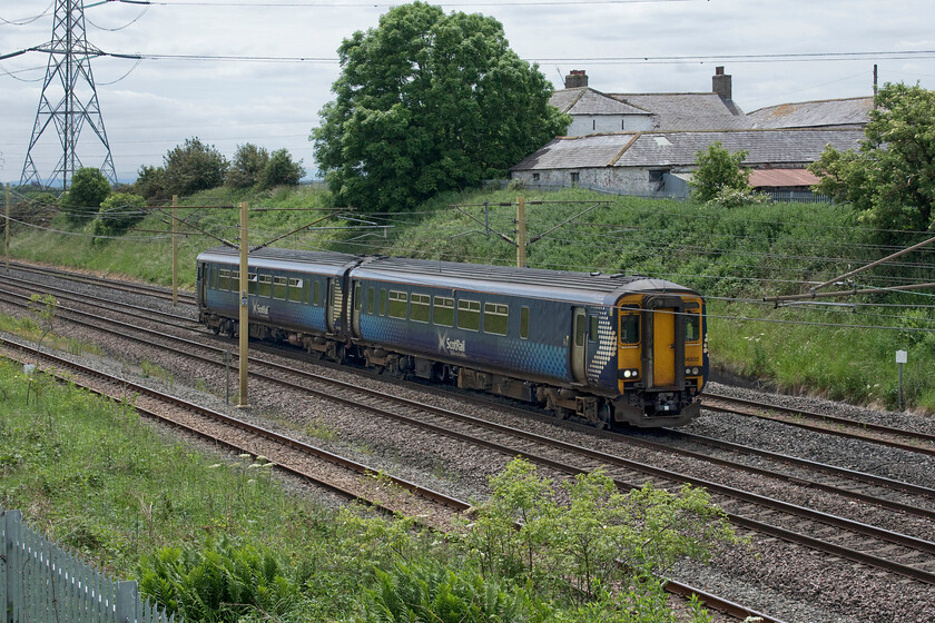 156502, SR 12.32 Carlisle-Dumfries (1L56, RT), Blackrigg bridge NY364624 
 With Blackrigg farm in the background giving its name to the bridge on which I am standing 156502 heads north with the 12.32 Carlisle to Dumfries ScotRail service. This location is just north of the vast Kingmoor Yard with the access line in the foreground just beginning to gain height in readiness to cross the other running lines some half a mile south of this location. 
 Keywords: 156502 12.32 Carlisle-Dumfries 1L56 Blackrigg bridge NY364624 ScotRail