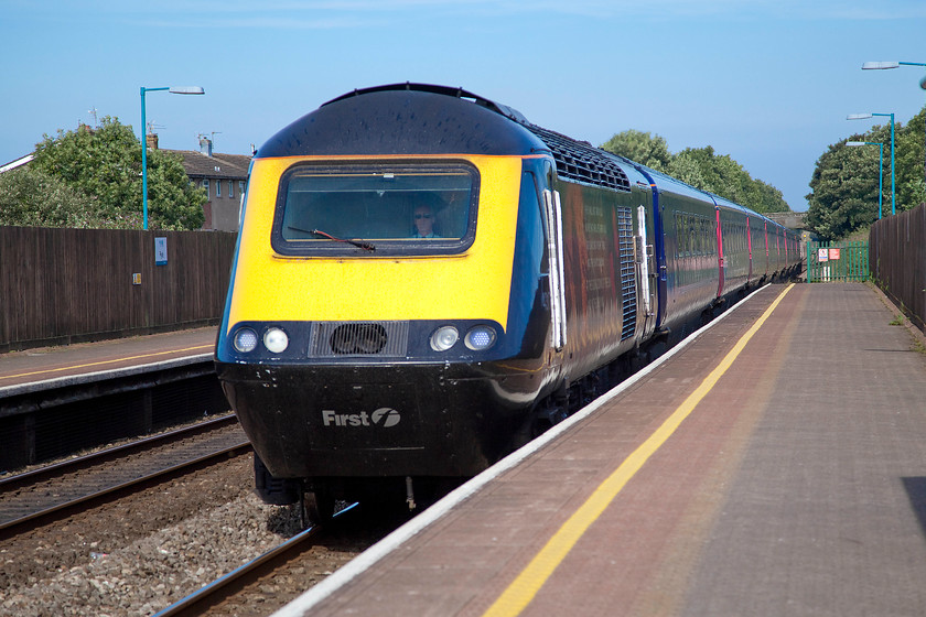 Class 43, GW 09.28 Swansea-London Paddington (1L48), Pyle station 
 This is a bit of 'grab shot' because Andy and I heard this train as we were walking up the ramp on to the staion at Pyle. The class 43 HST is passing at some speed being only 19 miles into its 190 journey to Paddington as the 09.28 1L48 from Swansea. It was travelling too fast to read its number, but, examination of the picture has revealed that it can only be 43172 'Harry Patch-The last survivor of the trenches.' The nose cone is not the usual blue but black and the vinyls applied to the side of the power unit are also visible along with the nameplate. 
 Keywords: Class 43 09.28 Swansea-London Paddington 1L48 Pyle station