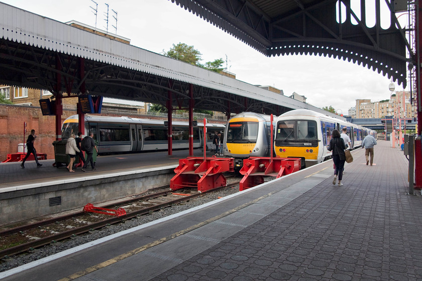 Class 168, CH 12.57 Marylebone-Aylesbury Vale Parkway (2V32, RT), 168324, CH 12.46 Marylebone-Gerrards Cross (2G32, RT) & 165002 & 165015, CH 12.43 Marylebone-Banbury (1U31, RT), London Marylebone station 
 Platforms four, five and six, shown in this view, were opened in in 2006 and dramatically improved the capacity of Marylebone station. In this scene, a variety of class 168 and 165 Turbostars wait to form various trains. From left to right, the 12.57 to Aylesbury Vale parkway, the 12.46 to Gerrards Cross and the 12.43 to Banbury. This final train, composed of 165002 and 165015, my wife, son and I took home to King's Sutton. 
 Keywords: Class 168 2V32 168324 2G32 165002 165015 1U31 London Marylebone station