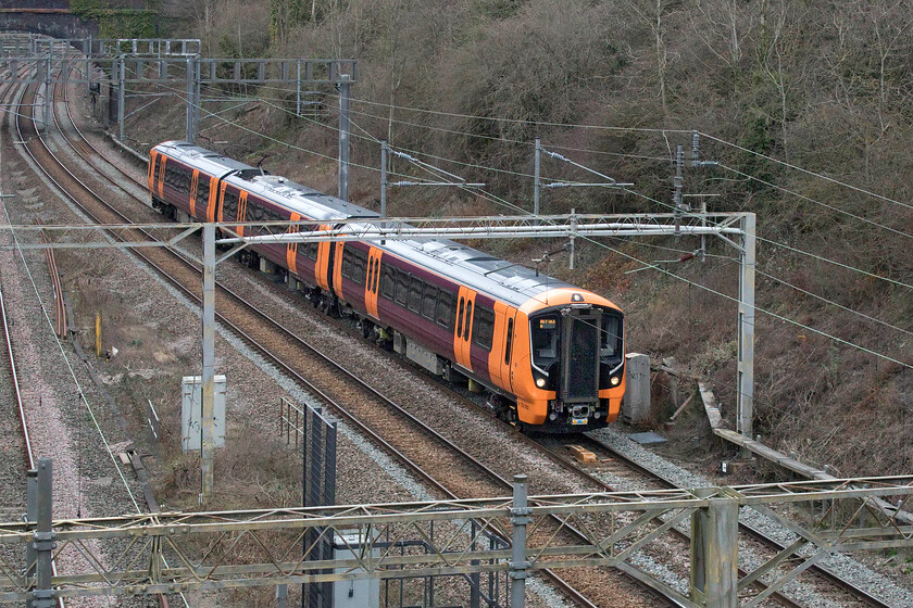 730002, 12.37 Crewe CS-London Euston (5Q43?, 3E), A508 bridge 
 The shape of things to come! Brand new and out of the box, 730002 takes a test run along a quiet WCML from Crewe to Euston on a Sunday afternoon. This three-car unit will be one of those that will work around the Greater Birmingham area replacing the Class 323s. On the section of line south of Northampton, there will be forty-five five-car units in operation that will not wear this rather garish West Midlands Trains' livery. The Class 730s are the first members of the Aventra family to feature end gangway connecting doors that do not really spoil their looks too much. 
 Keywords: 730002 12.37 Crewe CS-London Euston 5Q43 A508 bridge Aventra