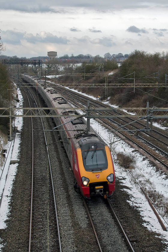 Class 221s, VT 08.52 Edinburgh-London Euston (9M52, 1L), Victoria bridge 
 A pair of Virgin Trains class 221s head south with the 08.52 Edinburgh to London Euston. Victoria bridge is one of my favourite local spots but today it was a cold and exposed place to be. The sky in the background looks particularly wintery with one of Roade's water towers in clear view silhouetted against it. 
 Keywords: Class 221s, 08.52 Edinburgh-London Euston 9M52 Victoria bridge